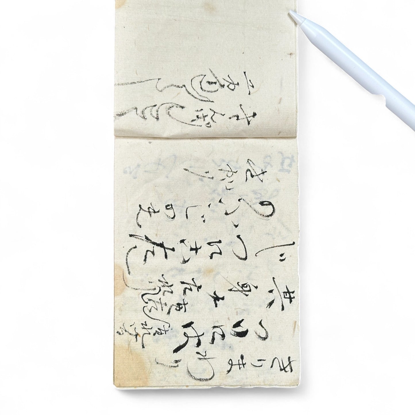 Edo-Meiji handwritten Japanese notebook with hentaigana cursive script on washi paper, tied with string binding.