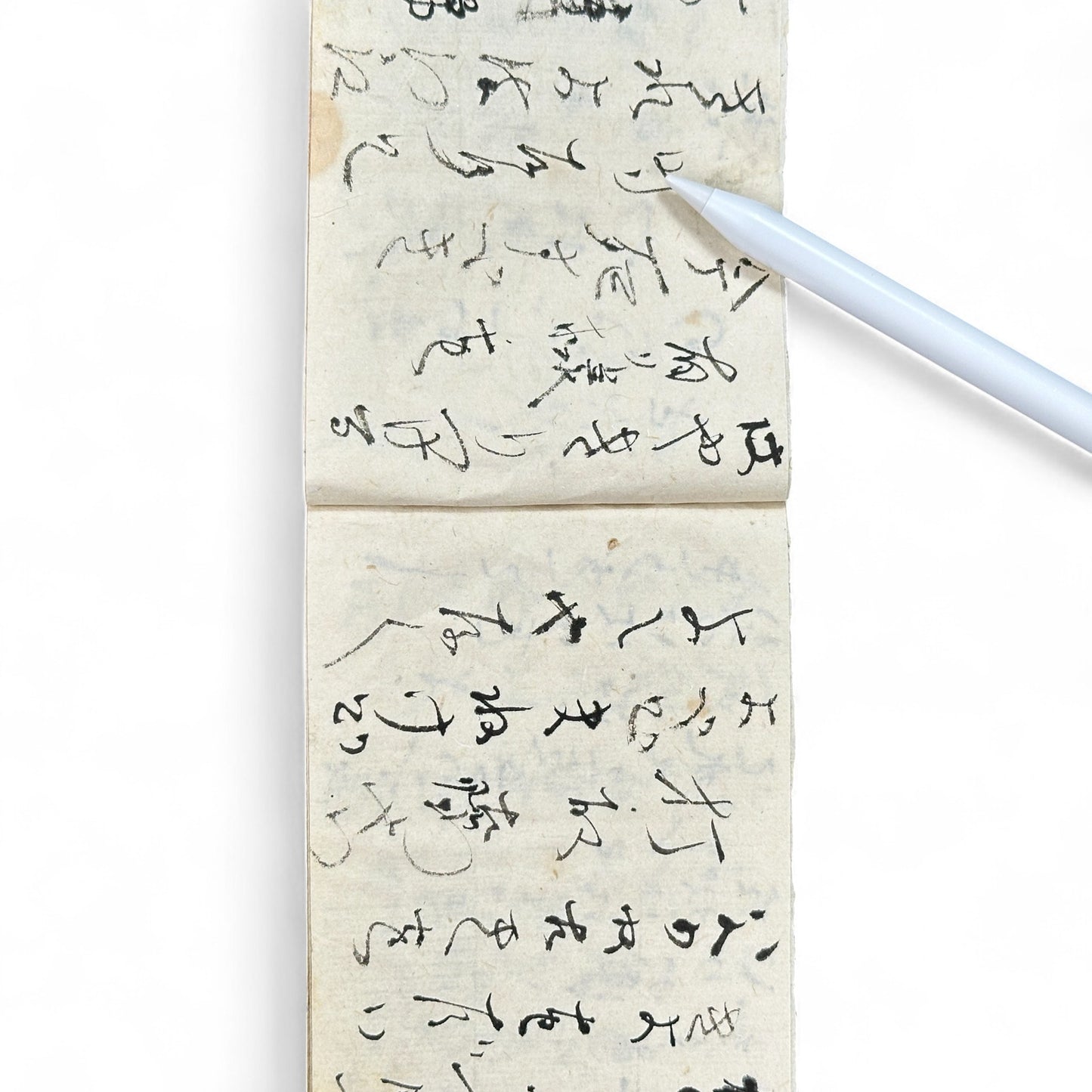 Edo-Meiji handwritten Japanese notebook with hentaigana cursive script on washi paper, tied with string binding.
