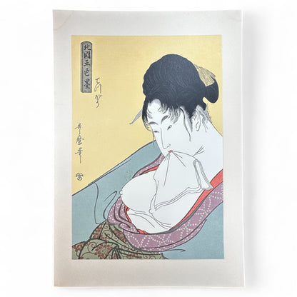 Utamaro ukiyo-e bijin-ga portrait – 北国五色墨 – Edo beauty holding cloth – Japanese woodblock print reproduction